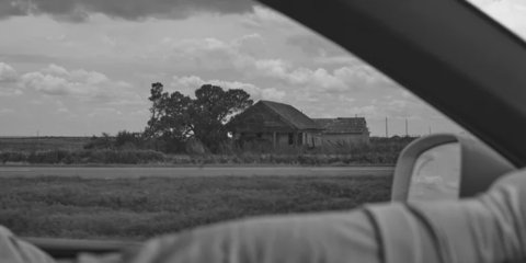 an abandoned shack along the road